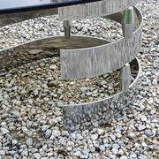 Oval coffee table of the 70s chromed metal base in s smoked glass top