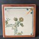Vintage ceramic trivet – stylised floral design
