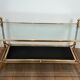 Brass coffee table with a black leather top and golden edges from Maison Jansen.