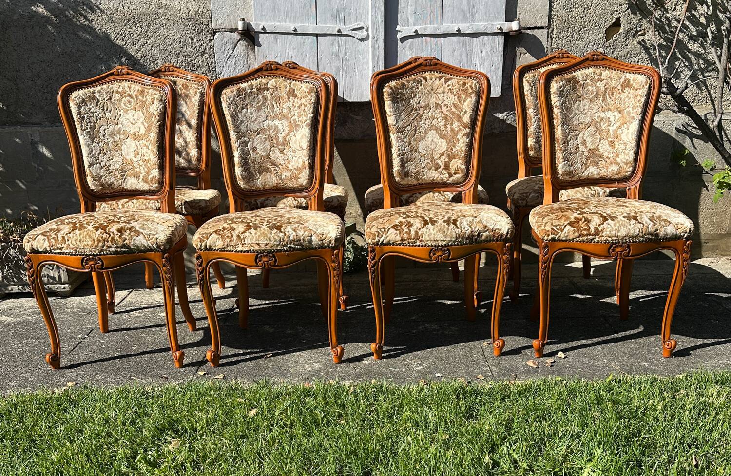 8 cherry wood chairs in Louis XV style with velvet upholstery.