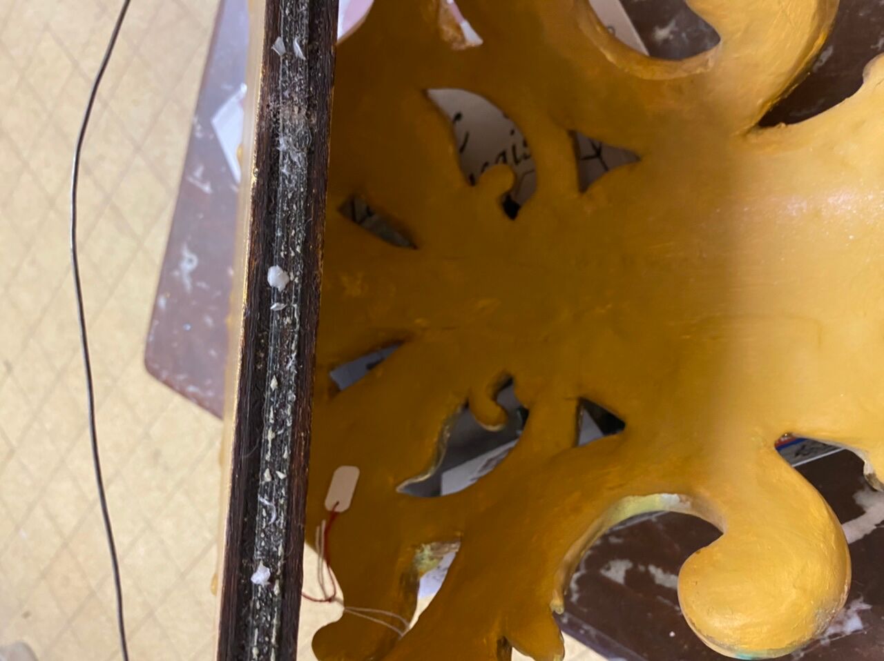 Golden wall applique with gold leaf