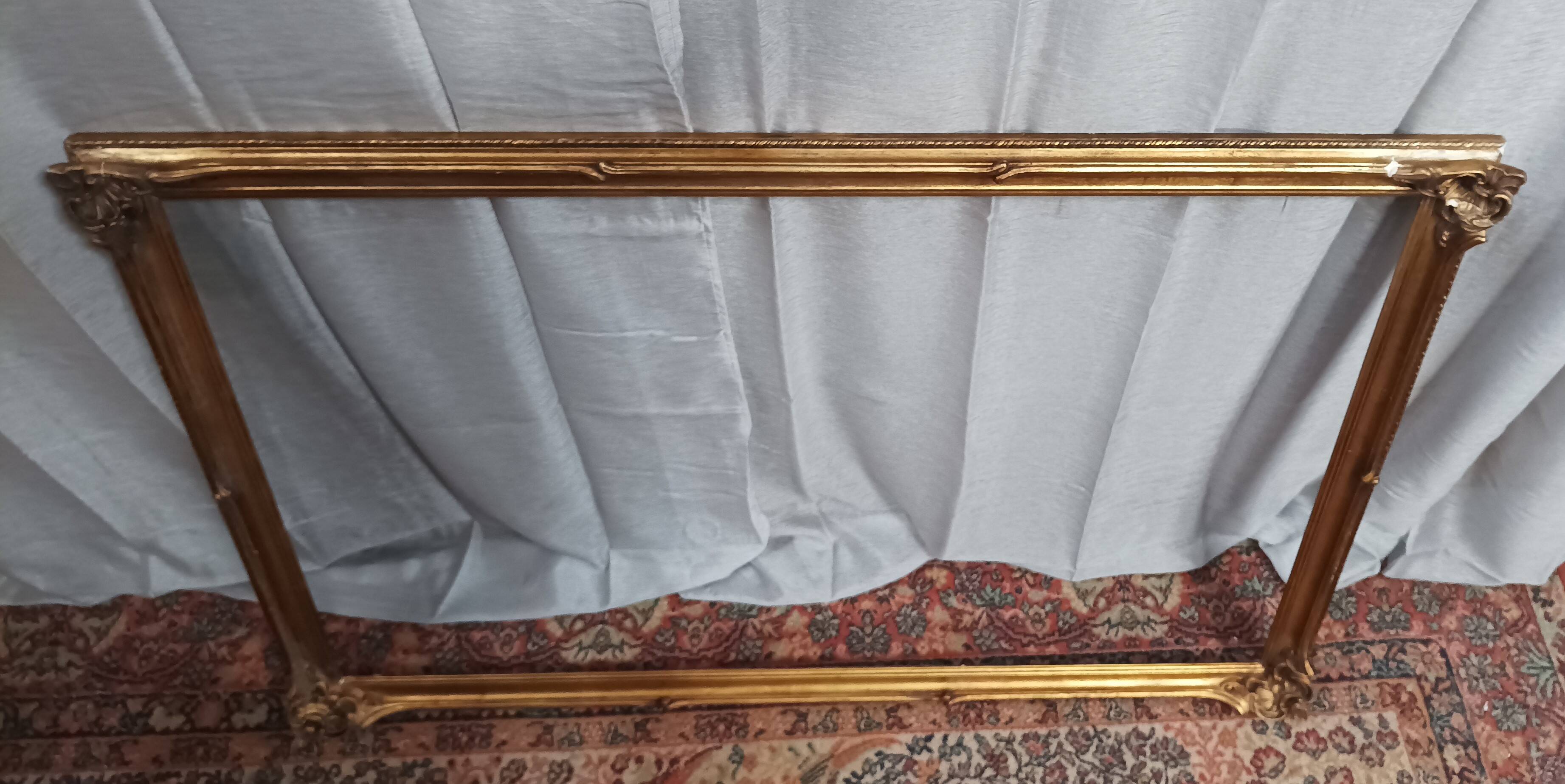 Old frame in wood and gilded stucco