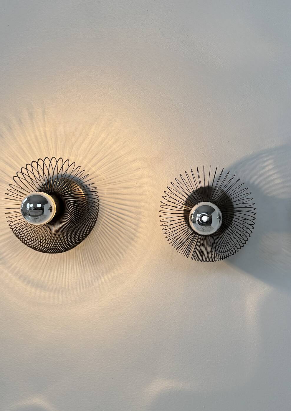 Vintage spring wall lights, matte metal, France, 1970.