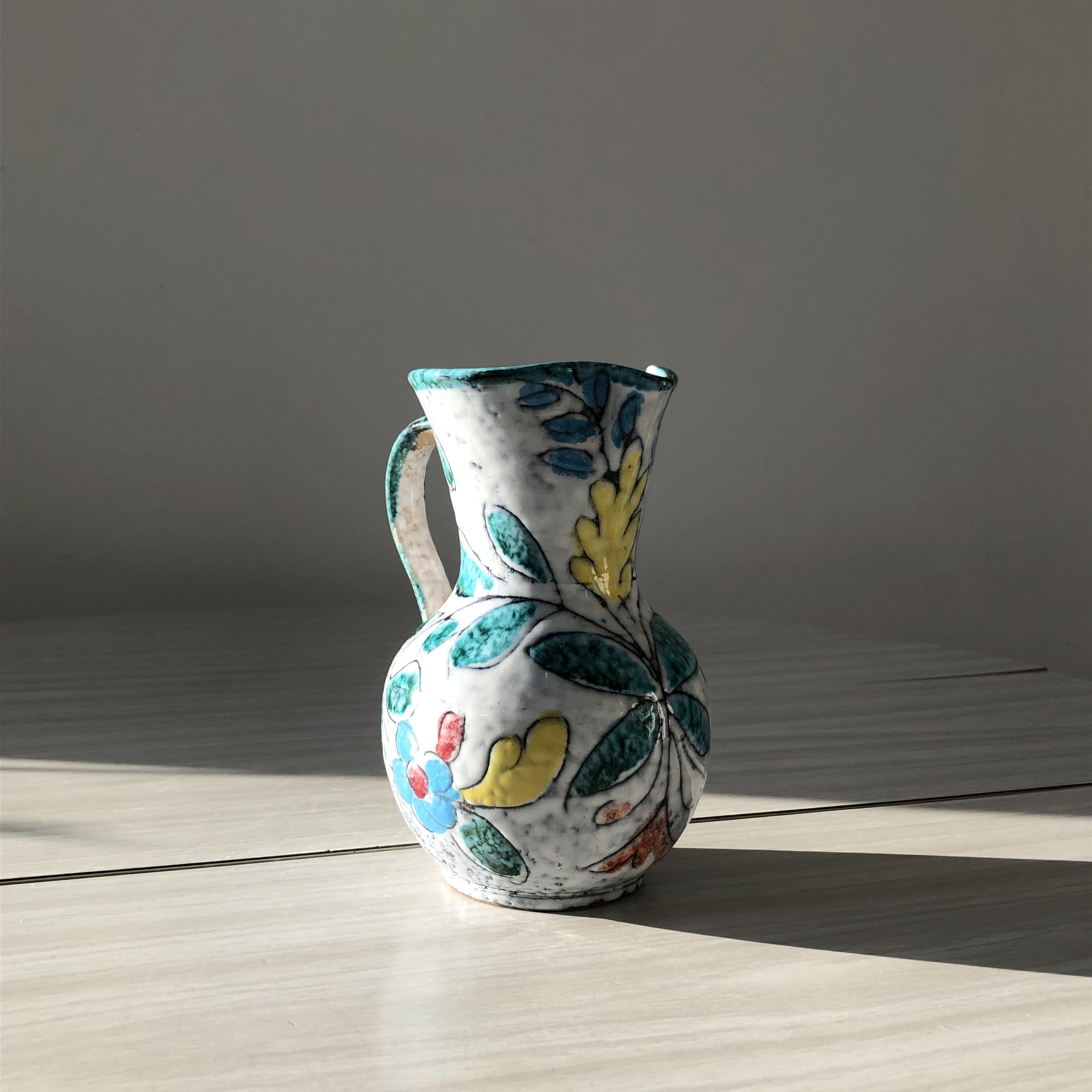 Ceramic vase pitcher with handles. Floral decoration, made in Italy.