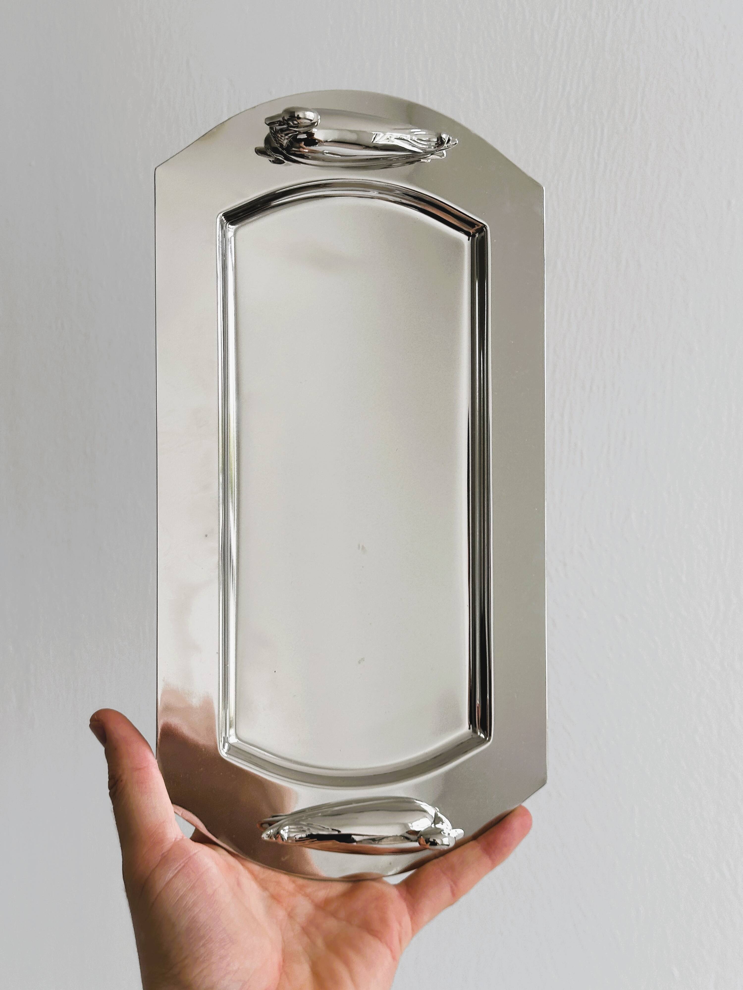 Shiny metal foie gras dish