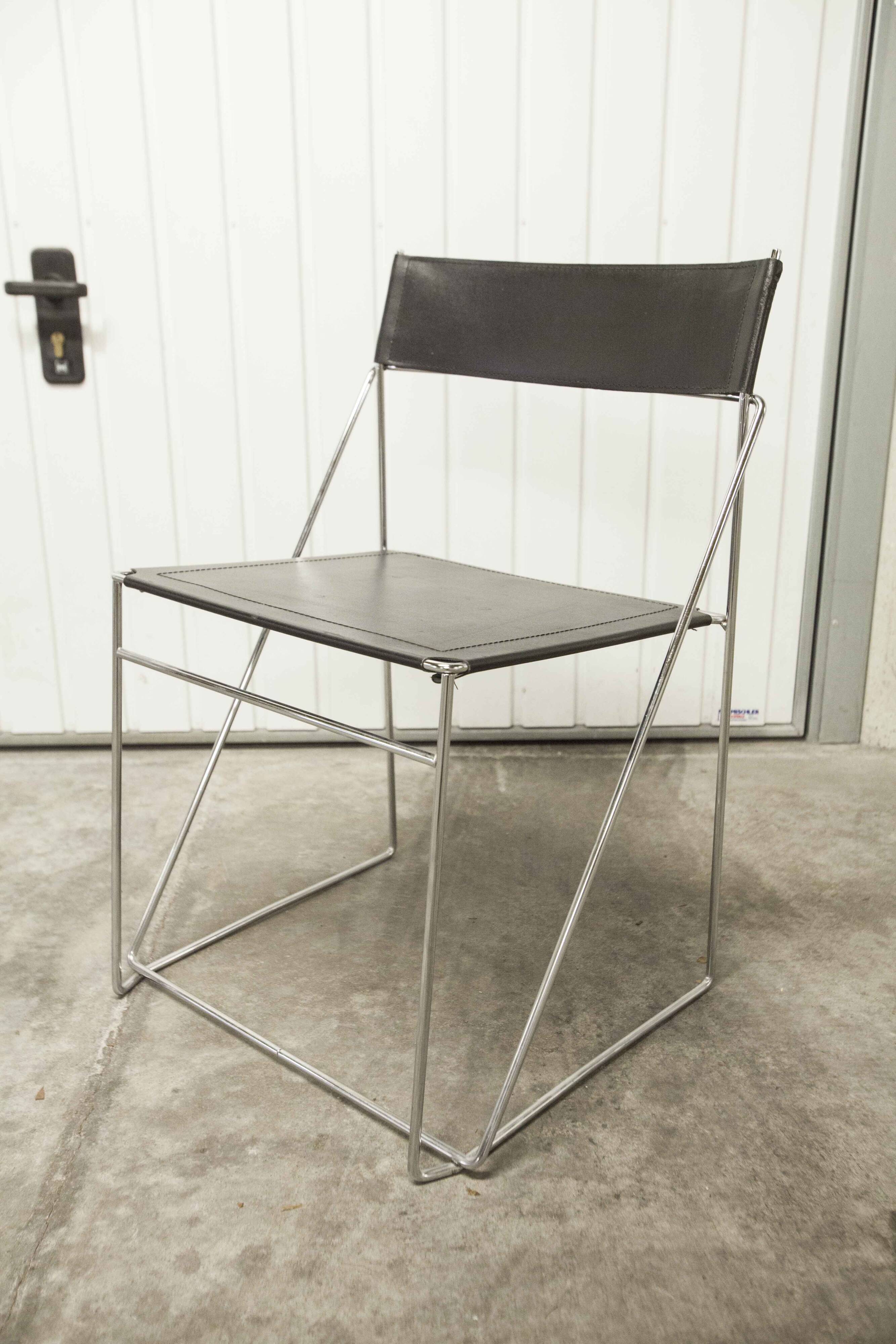 Set of 3 minimalist X line chairs by Niels Jorgen Haugesen.