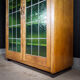Bibliothèque antique avec portes en verre souillé Brun / Vert - années 1920