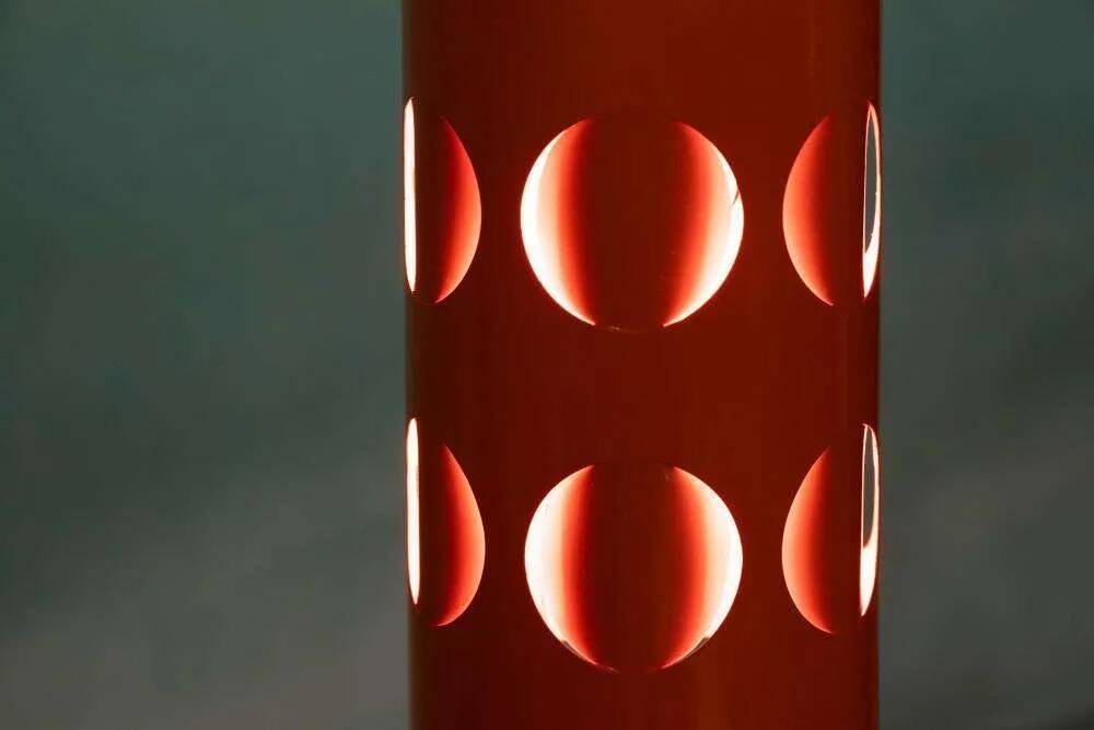 Vintage orange suspension light in a 1970s space age style.