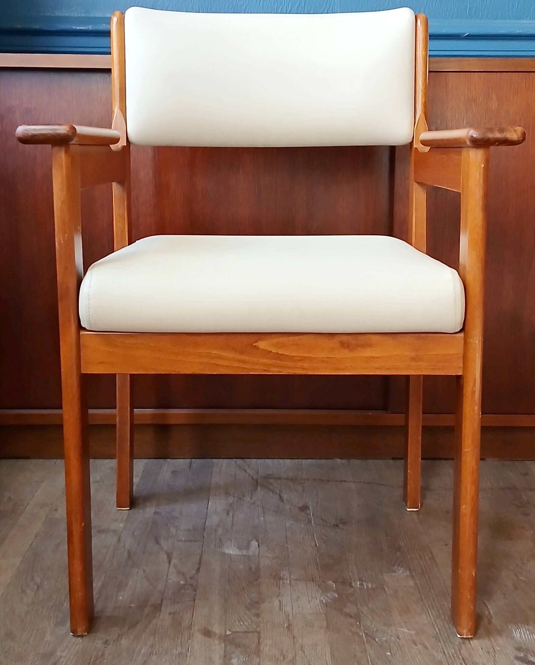Armchair by André Sornay, stained solid beech & beige faux leather. 1980