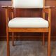 Armchair by André Sornay, stained solid beech & beige faux leather. 1980