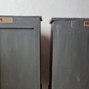Pair of antique bedside tables with a green patina
