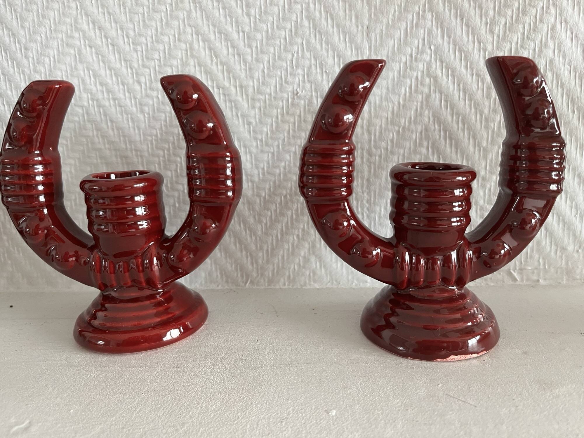 2 fifties red ceramic candle holders, horseshoe pattern