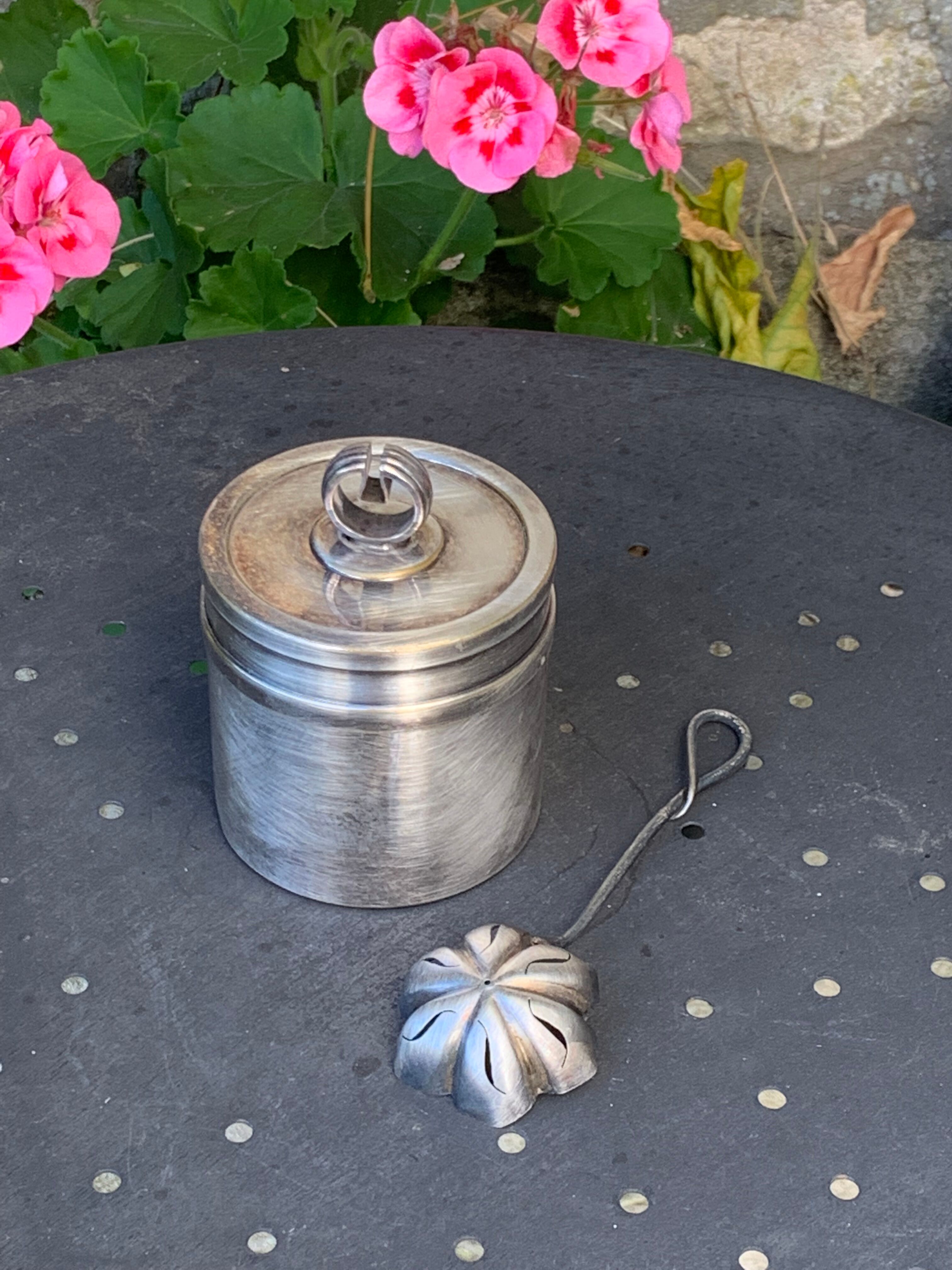Sprinkling spoon and art deco sugar pot in silver metal