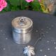 Sprinkling spoon and art deco sugar pot in silver metal