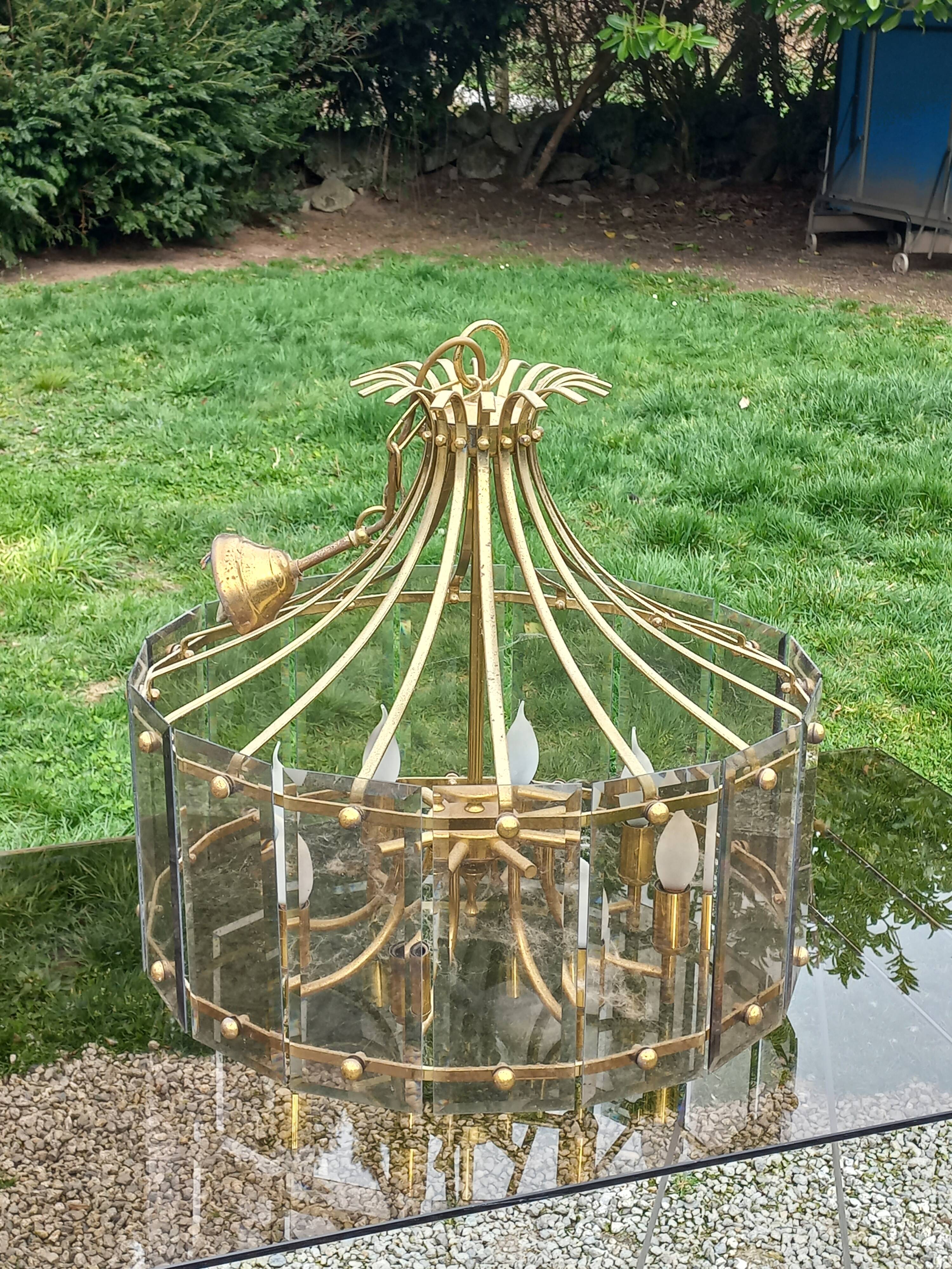 70s designer chandelier with smoked glass plates and gold metal frame