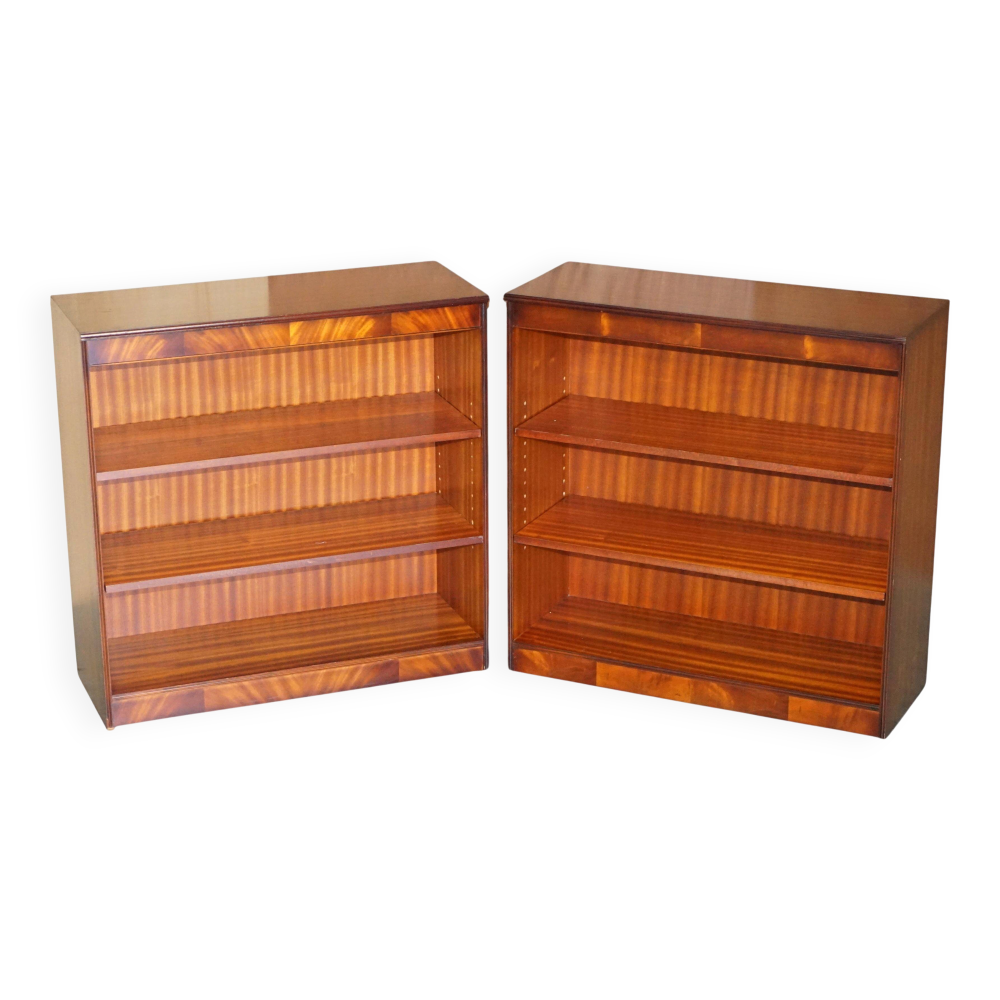 Pair of open low bookshelves Shaws of London in hardwood.