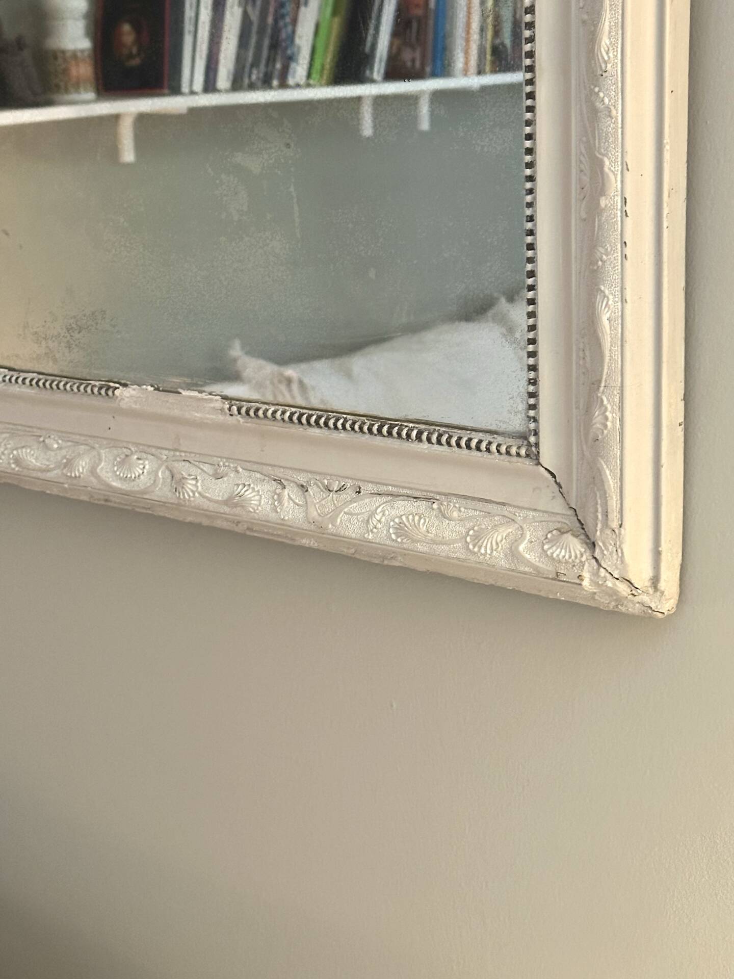 Antique Louis-Philippe mirror with pearls and shells, white patina.
