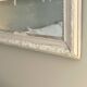 Antique Louis-Philippe mirror with pearls and shells, white patina.