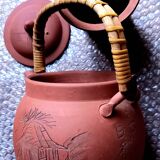 Terracotta and rattan teapot
