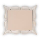 Art Deco style stucco mirror in the shape of a "moustache". 1990s.