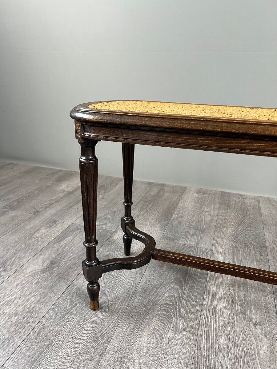 Antique wooden bench, caned seat, Louis XVI style, 20th century.