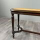 Antique wooden bench, caned seat, Louis XVI style, 20th century.
