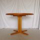 Expandable round table in teak