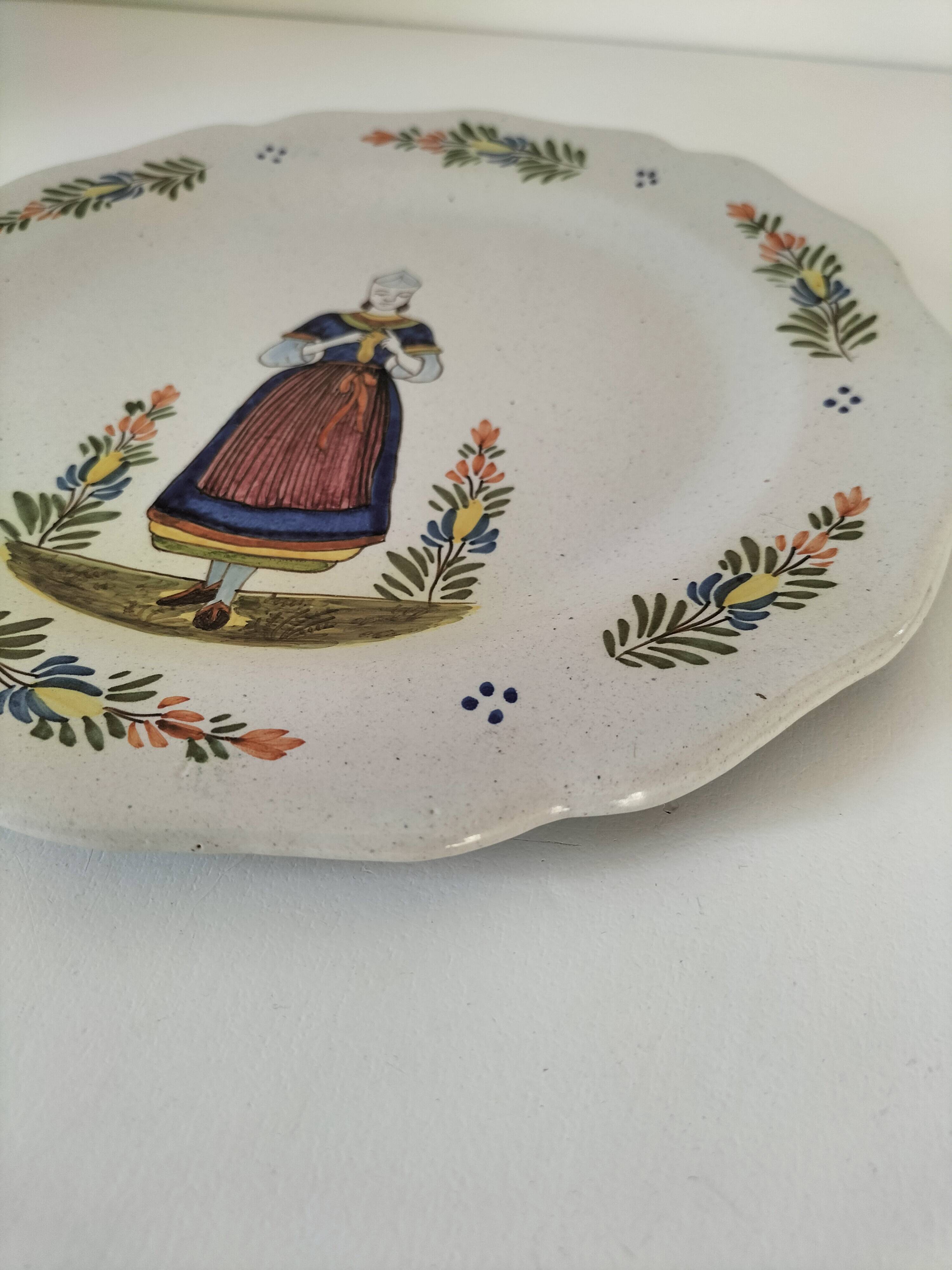 Hand-painted Breton plate, decorated with a woman knitting, 1950s