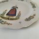 Hand-painted Breton plate, decorated with a woman knitting, 1950s