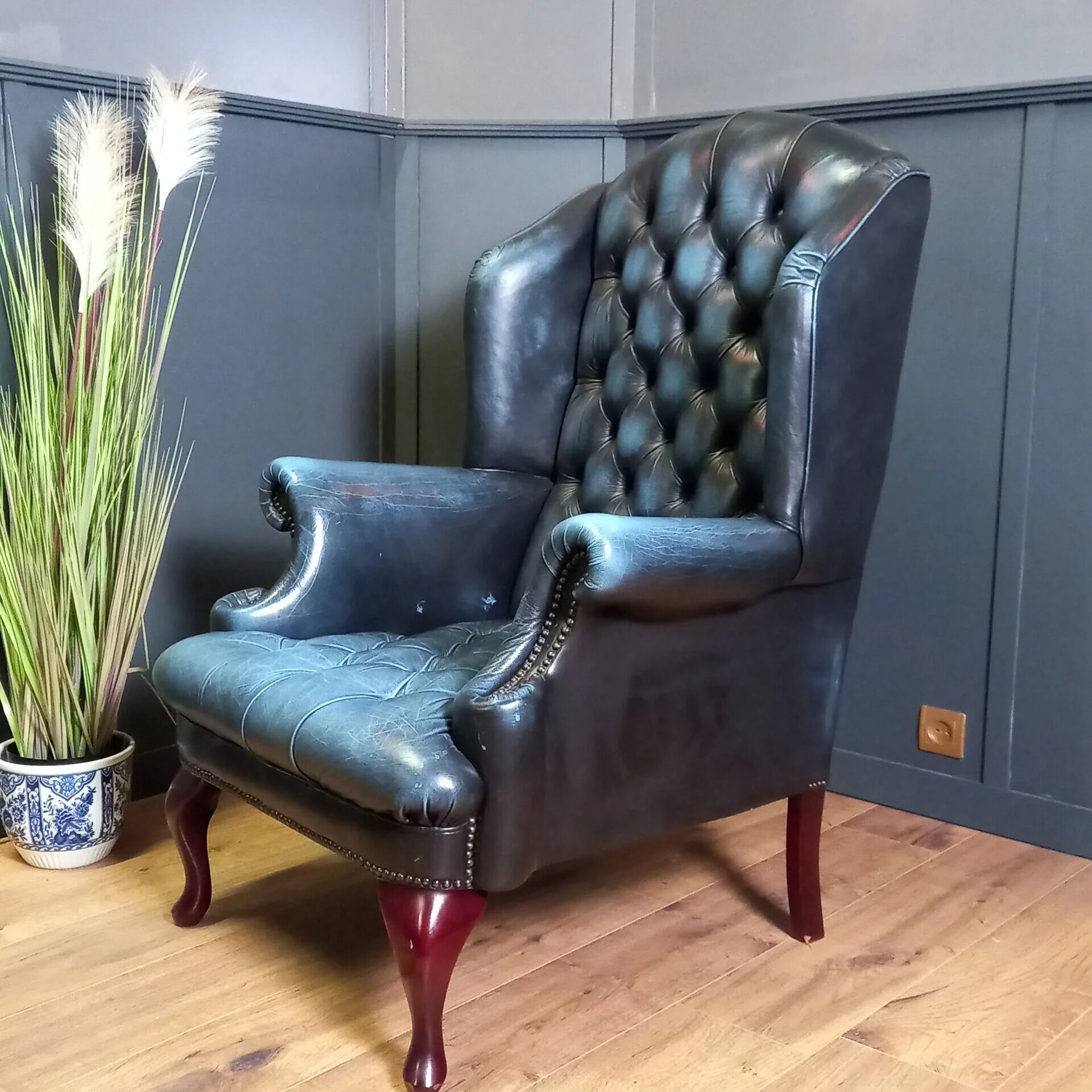 Blue chesterfield barrel back armchair