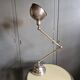 Old adjustable industrial lamp in bronze with 2 arms.