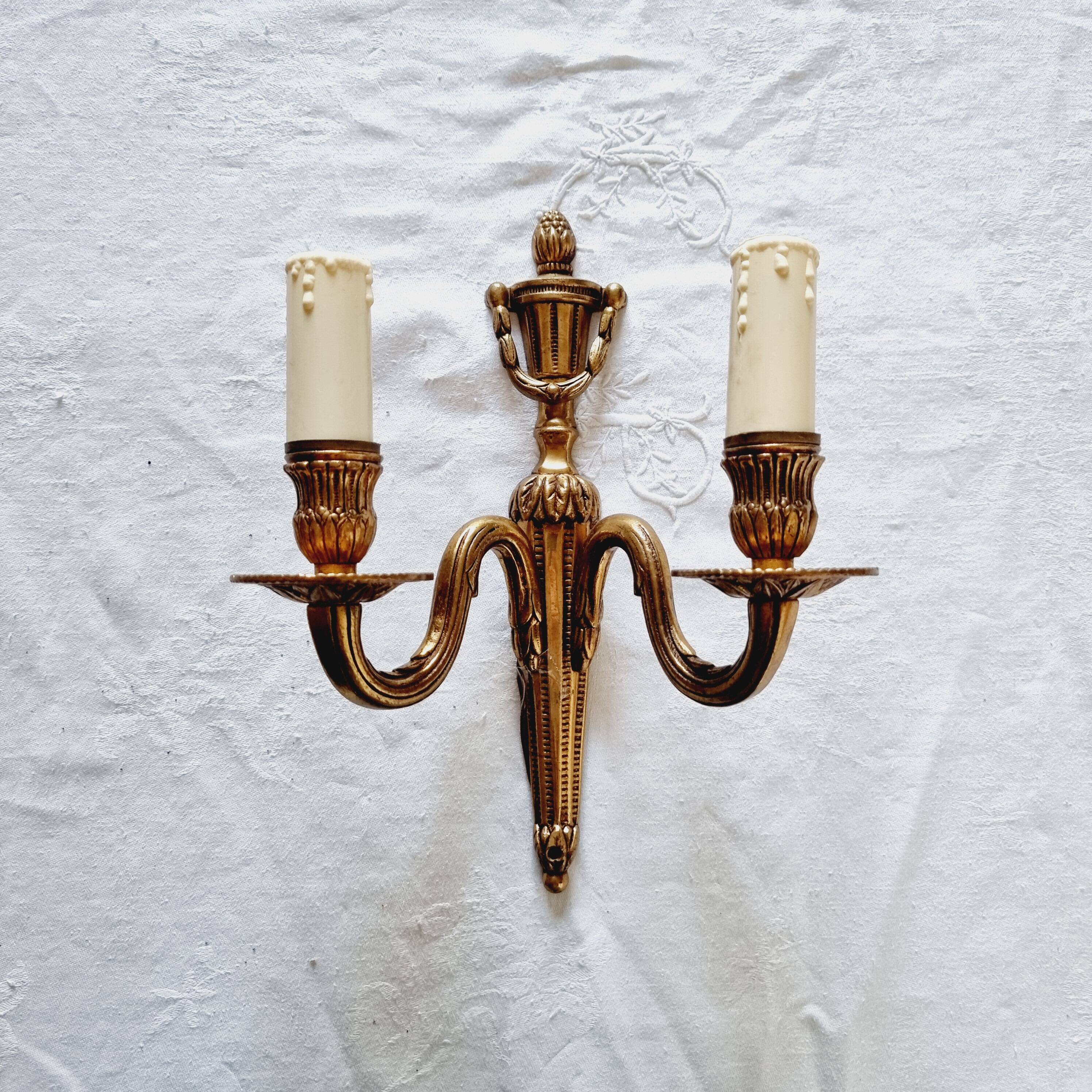 French Empire-style wall sconce or chandelier in bronze with an antique gold patina.