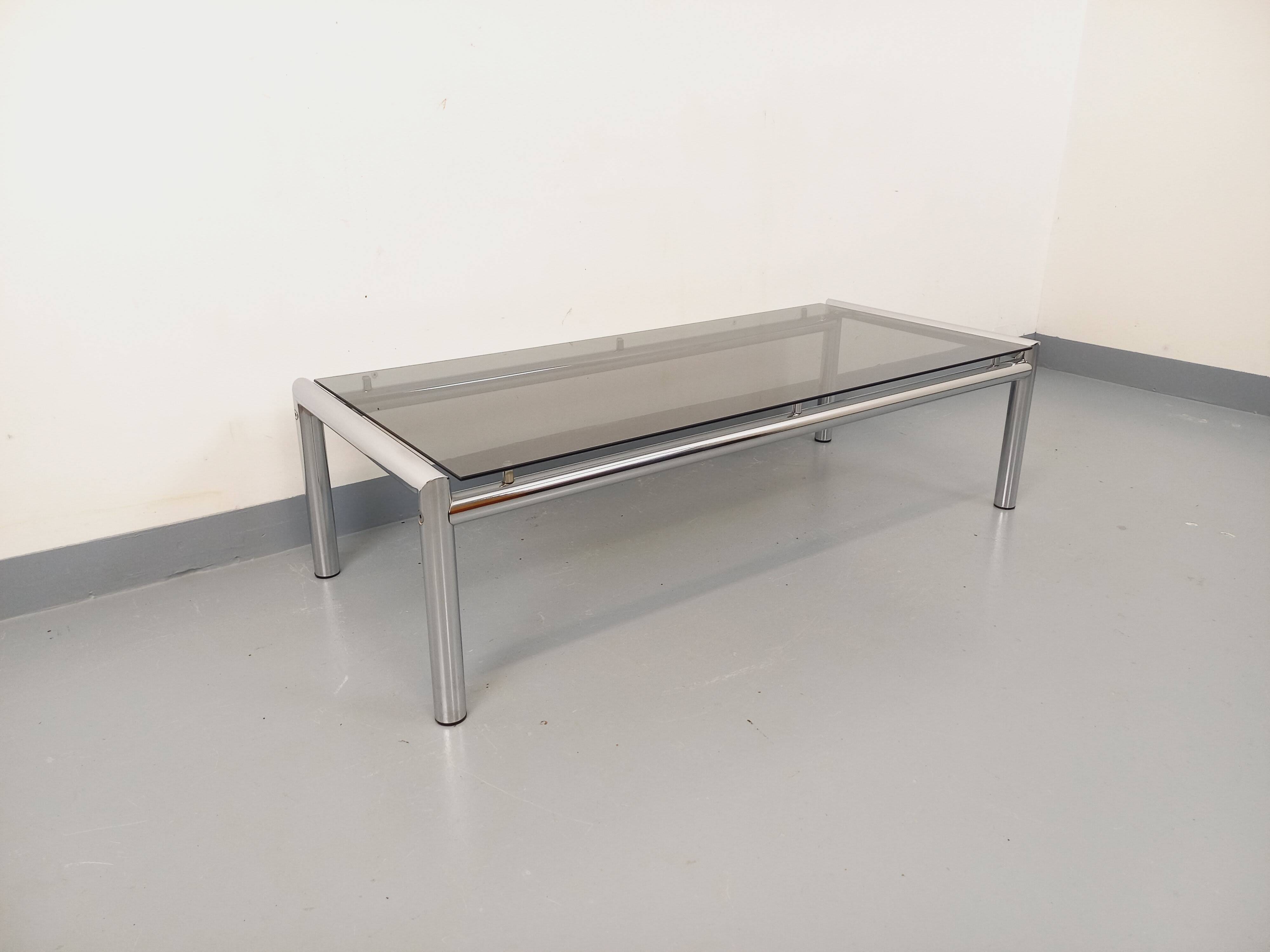 Vintage rectangular coffee table in smoked glass and chrome metal from the 1960s.