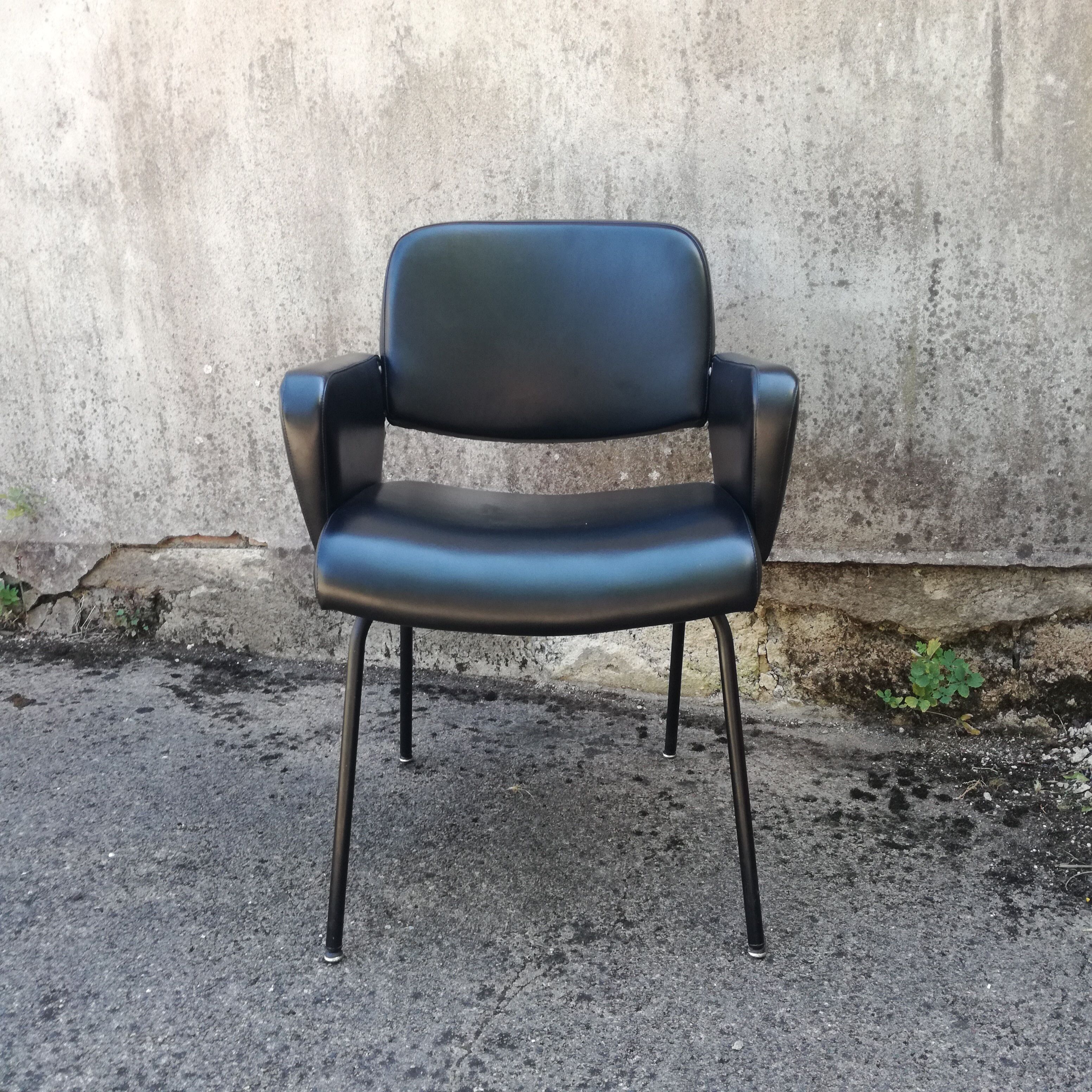 Black office chair in imitation leather