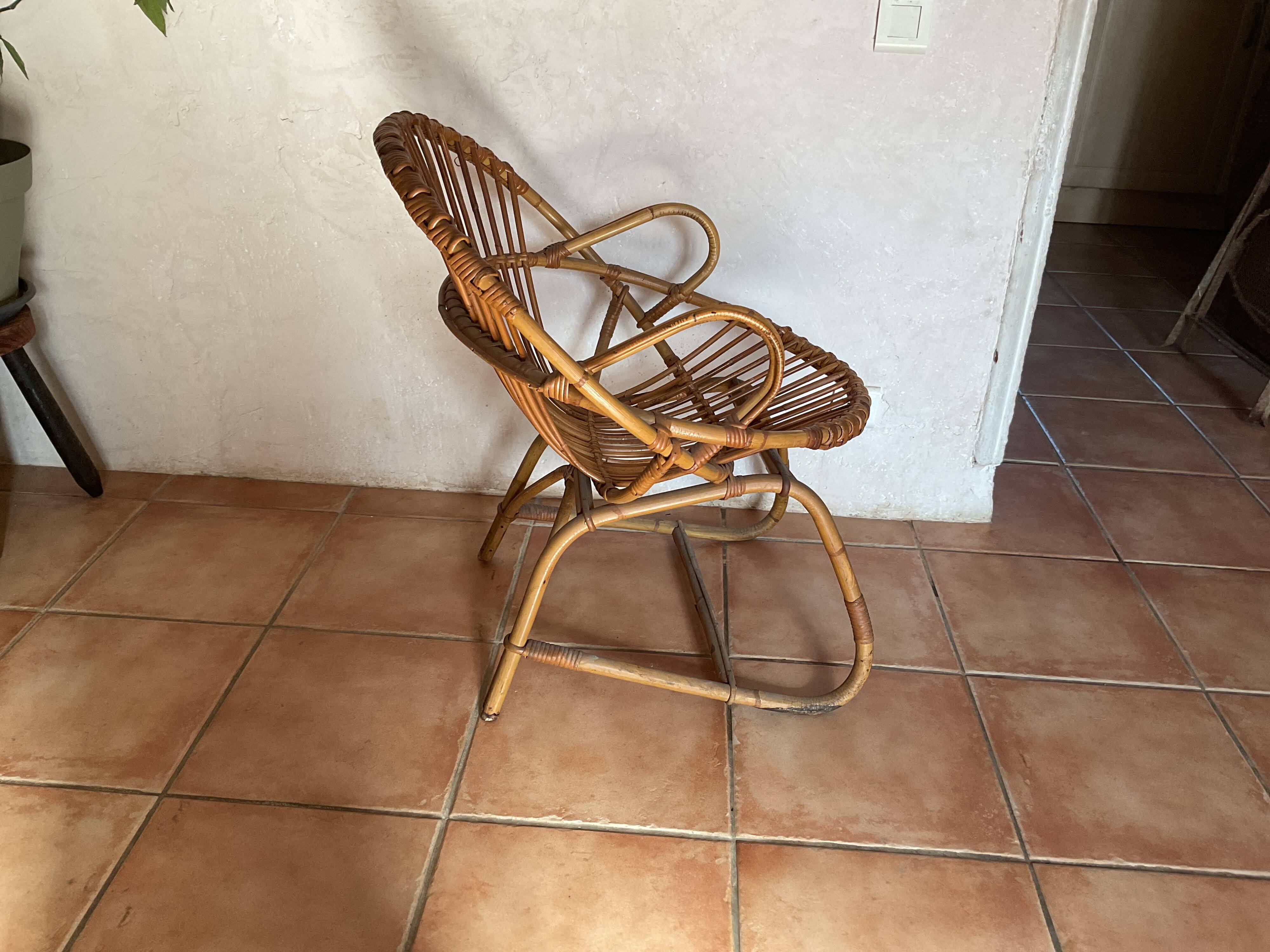 Rattan armchair with vintage design armrests