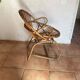Rattan armchair with vintage design armrests