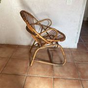 Rattan armchair with vintage design armrests