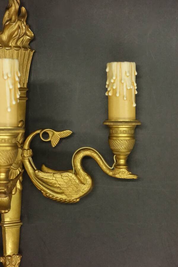 Pair of large wall sconces, torch and swans, Empire style - gilded bronze