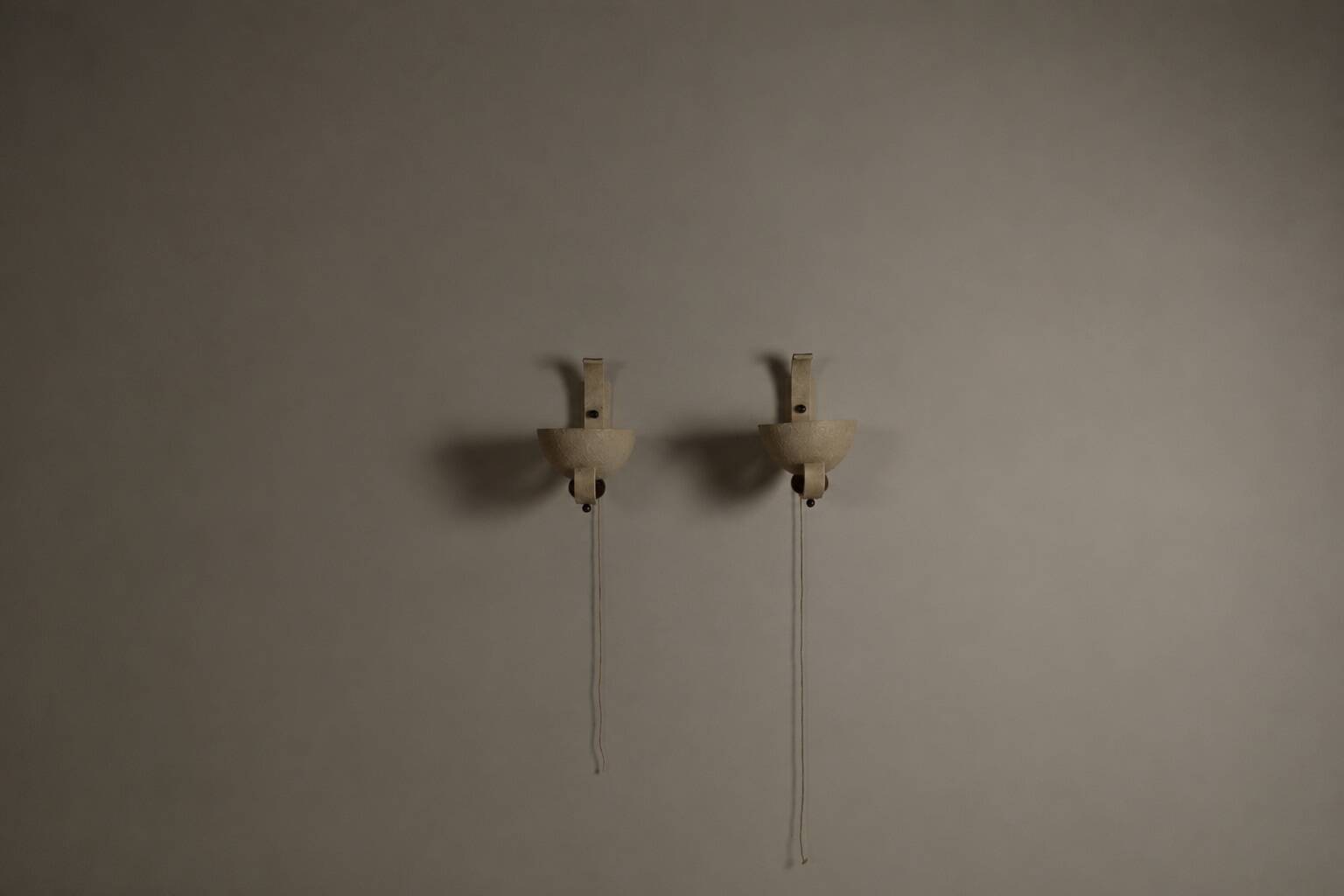 Pair of sculptural mid-century wall uplighters, circa 1950