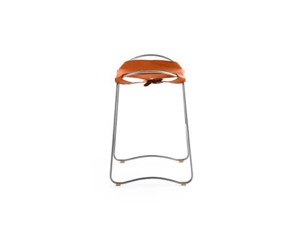 Contemporary bar stool with organic design in aged silver metal and natural tobacco leather.