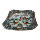 Porcelain plate with several roosters