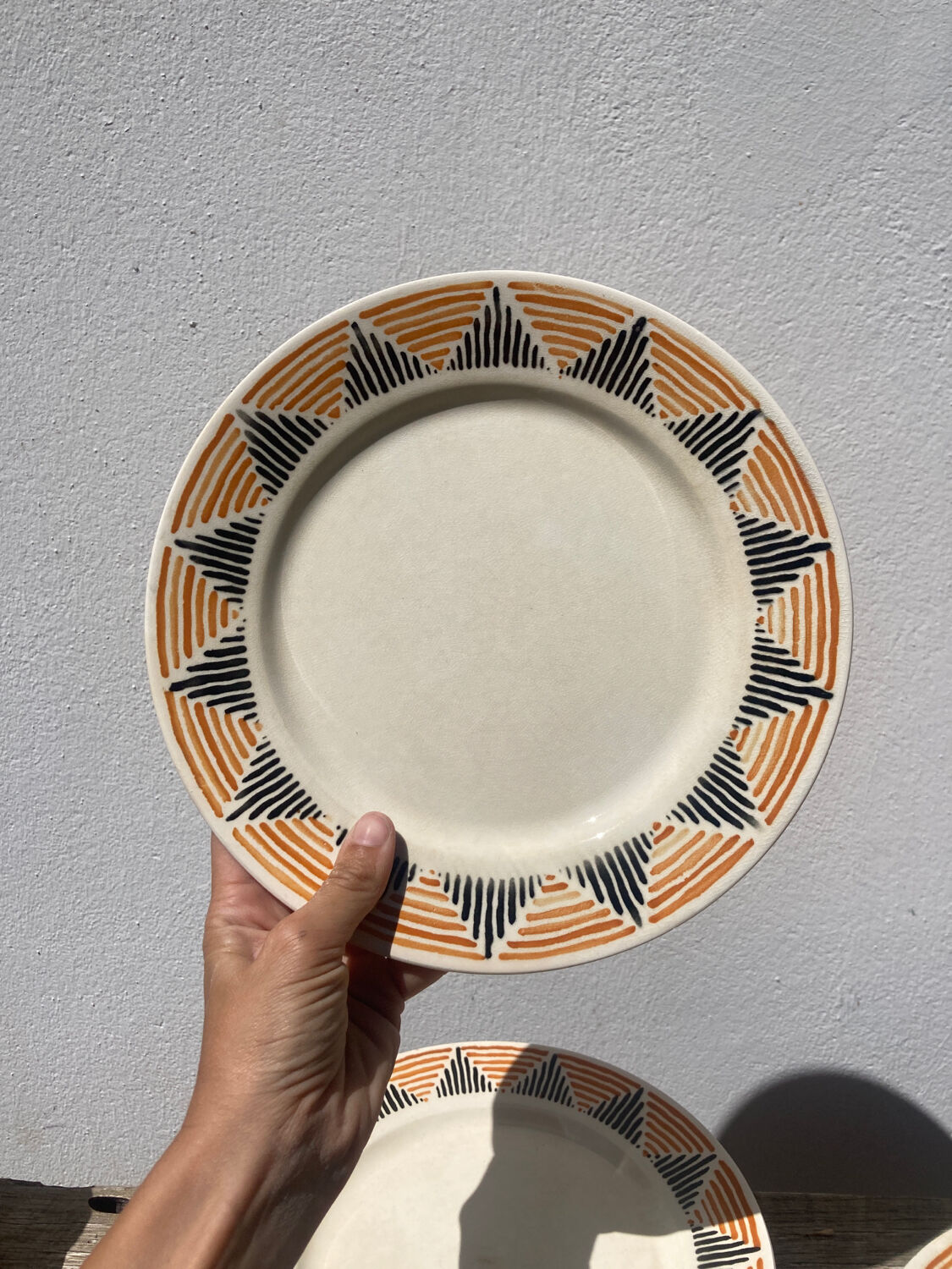 12 flat plates in yellow earthenware Badonviller