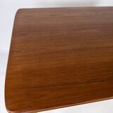 Dining table in teak with extentions and legs in oak, of danish design from the 1960s.