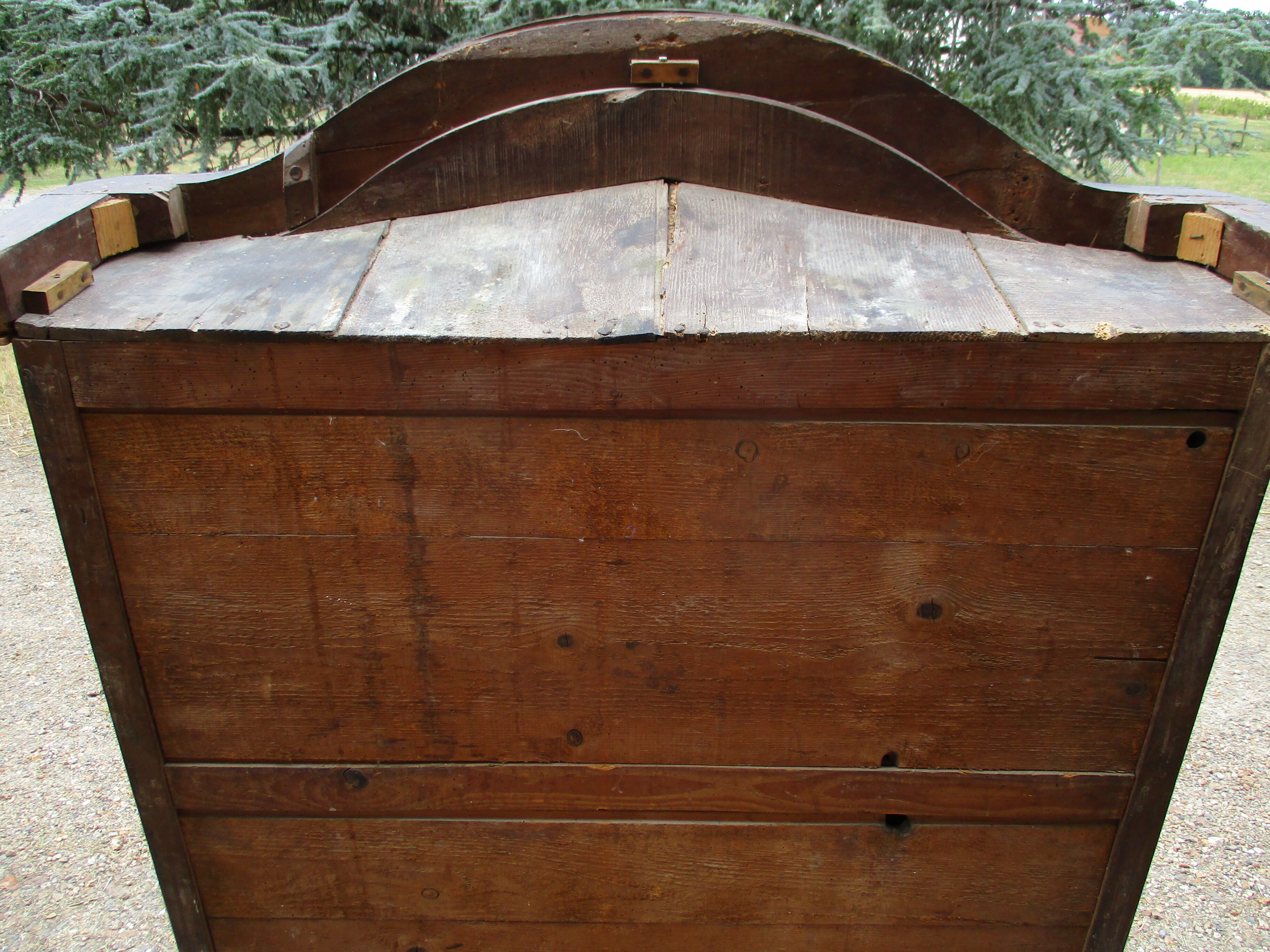 Small solid wooden cabinet with a gendarme hat