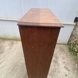 Oak two-column filing cabinet with curtains.