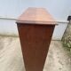 Oak two-column filing cabinet with curtains.