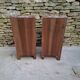 Corner bedside tables, in walnut