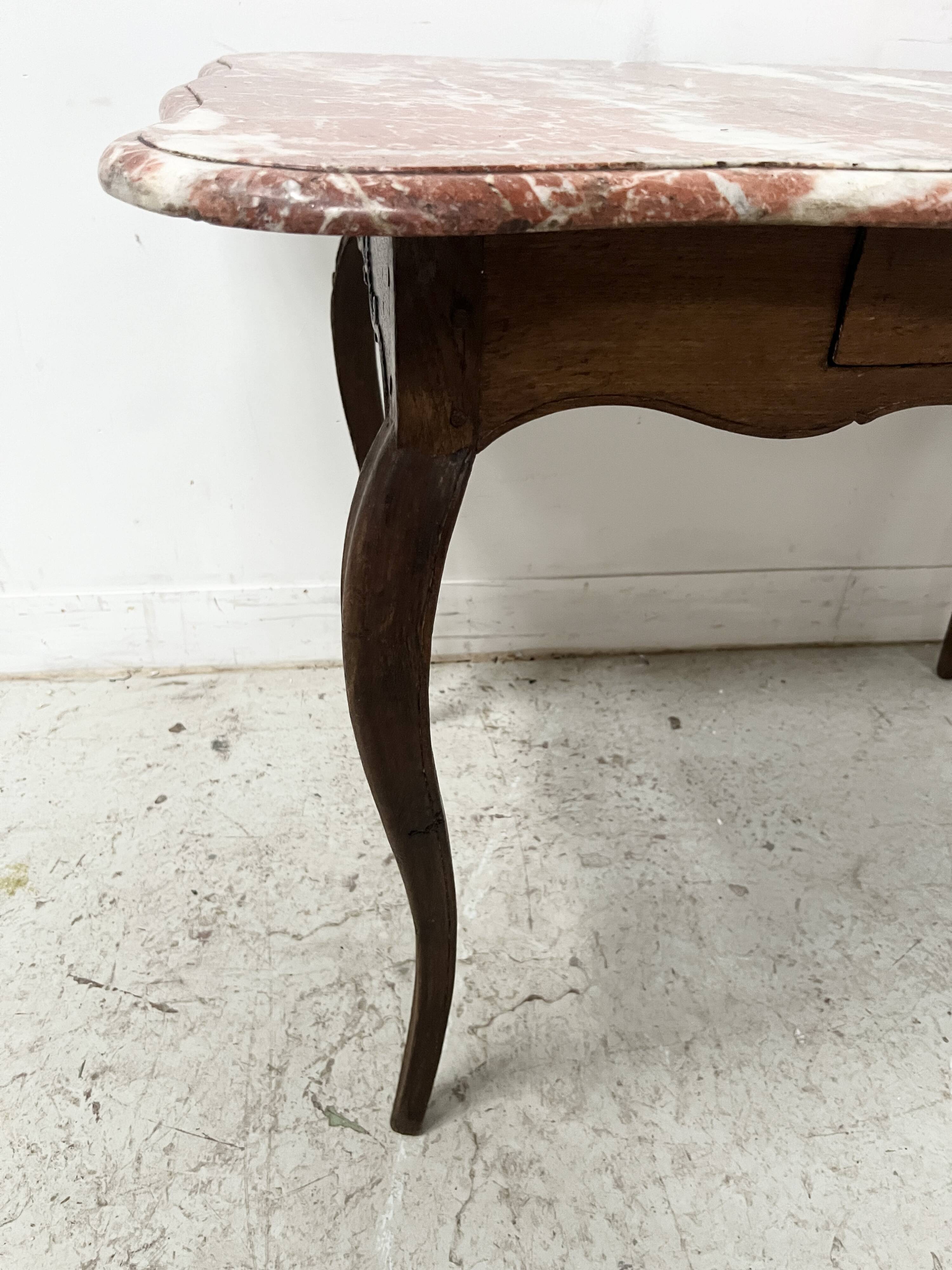 Louis XV mid-table in oak and marble, 18th century.