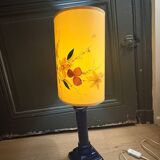 Corinthian column lamp base in blue with a lampshade of dried flowers.