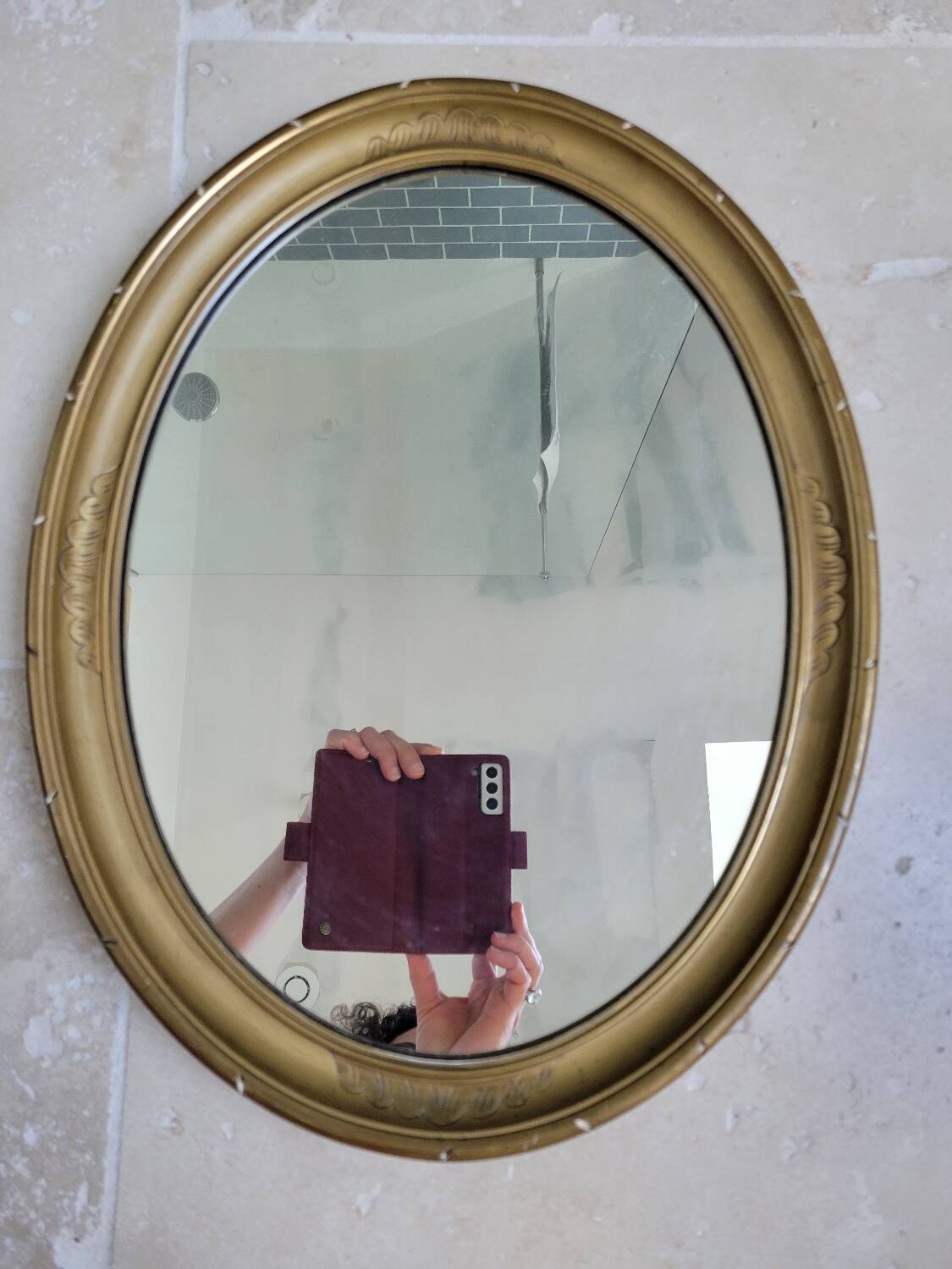 Oval mirror in gilded stucco 45 cm